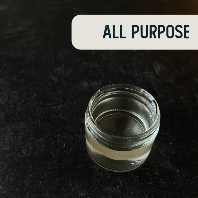 Clear all purpose cleaner in a 2oz clear glass jar