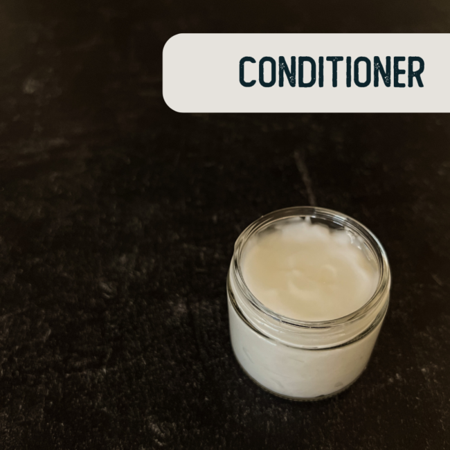 White conditioner in a 2oz clear glass jar