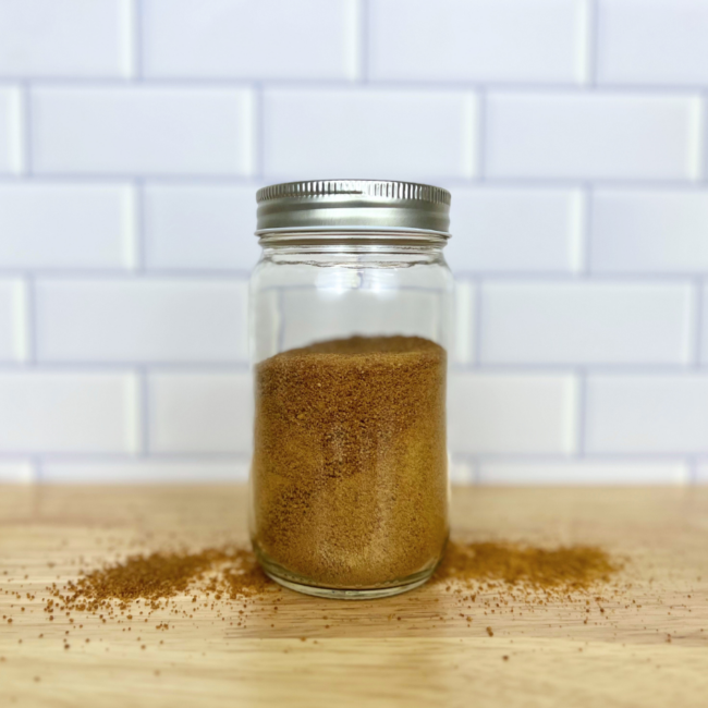 Coconut sugar in a clear glass mason jar