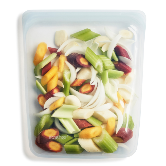 a clear half gallon Stasher bag containing raw chopped vegetables